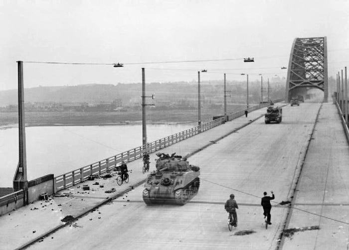 Tanks from British XXX Corps cross bridge at Nijmegen
